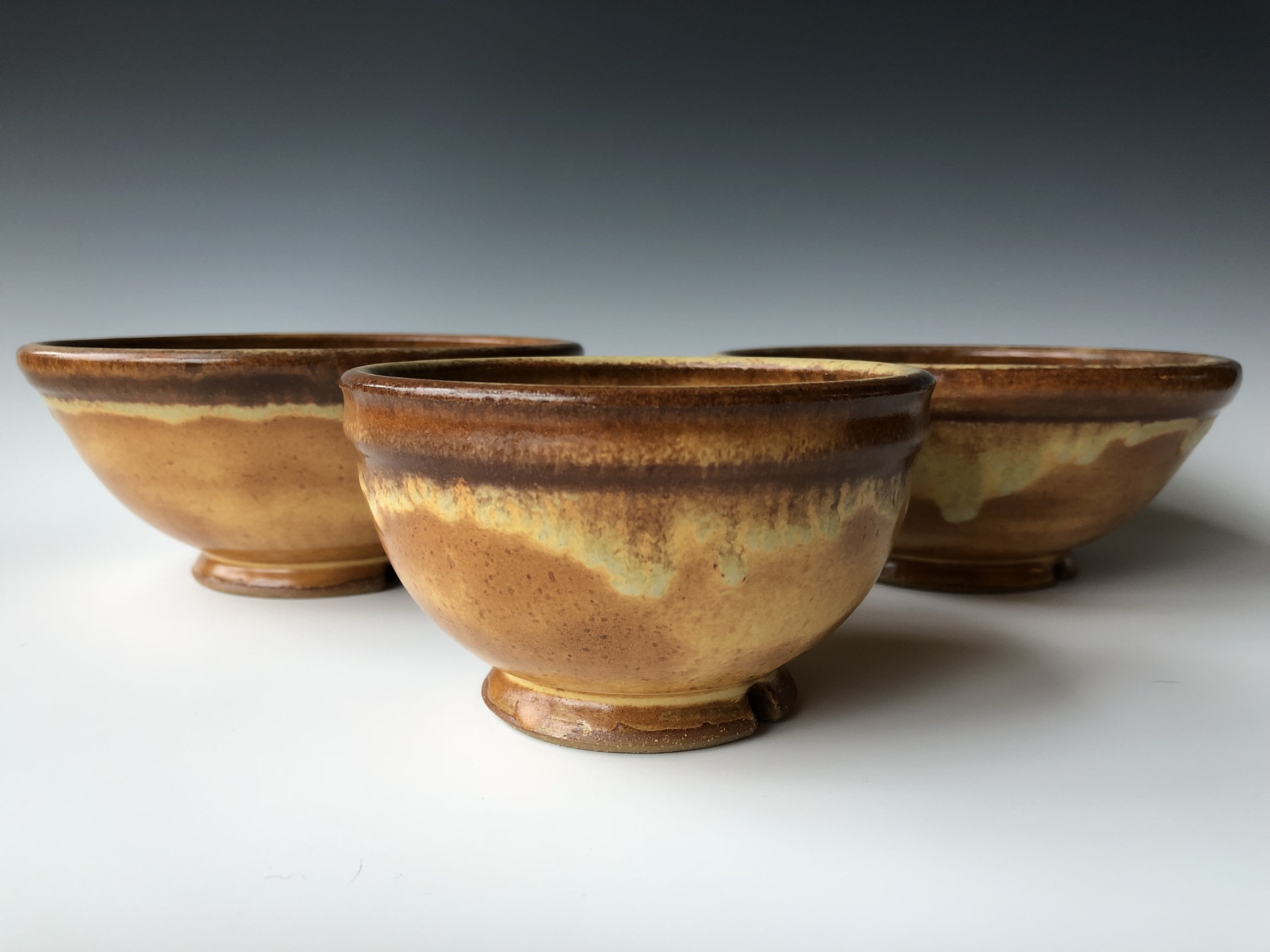 Set of amber-glazed stoneware bowls